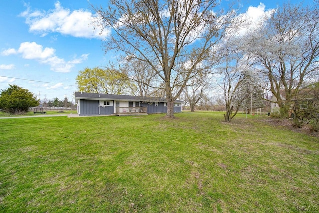 view of yard with a wooden deck