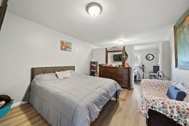 bedroom featuring light wood-style floors