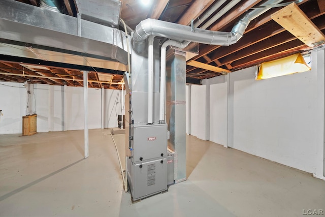 unfinished below grade area featuring heating unit