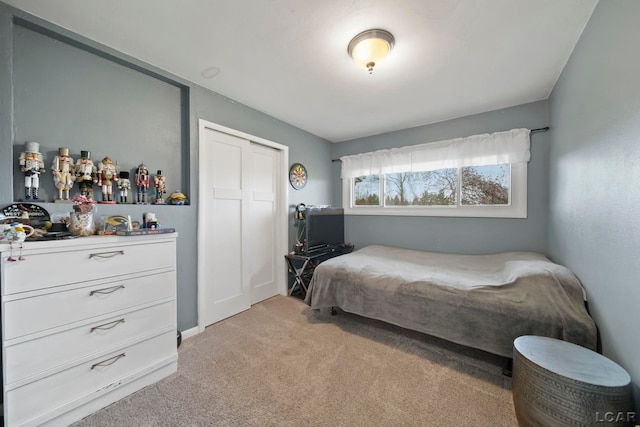 bedroom featuring light colored carpet