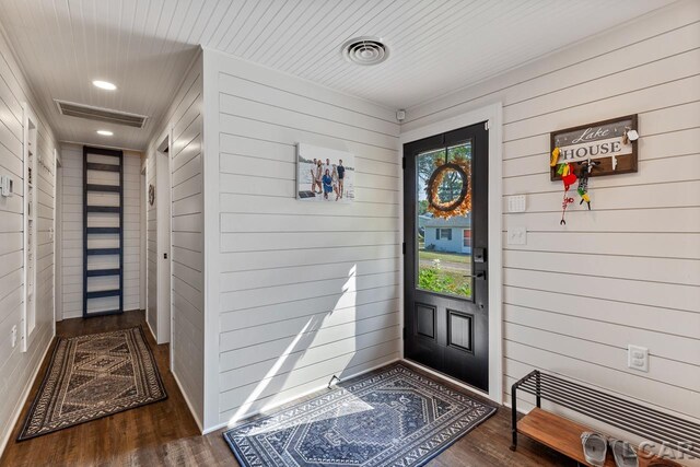 view of exterior entry featuring covered porch