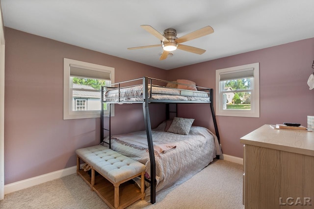 carpeted bedroom featuring ceiling fan