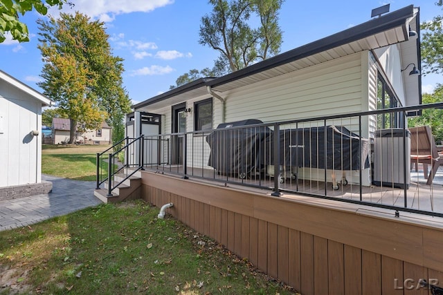 view of property exterior with a yard