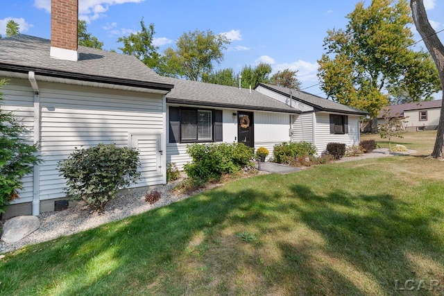 single story home with a front yard