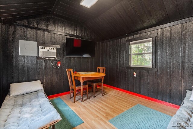 playroom with a wall mounted air conditioner, hardwood / wood-style floors, wooden ceiling, and lofted ceiling