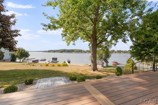 deck featuring a water view and a yard