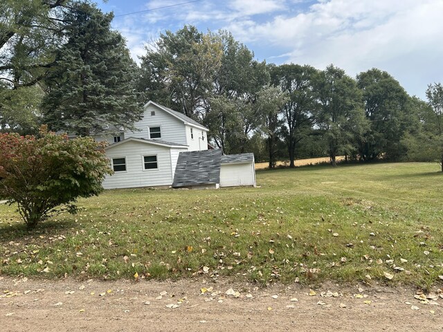13664 Wabasis Ave NE, Cedar Springs, MI 49319 - view of grassy yard featuring view of wooded area