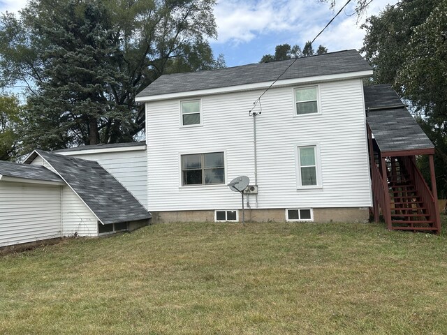 13664 Wabasis Ave NE, Cedar Springs, MI 49319 - rear view of property with stairs, a lawn, and a shingled roof