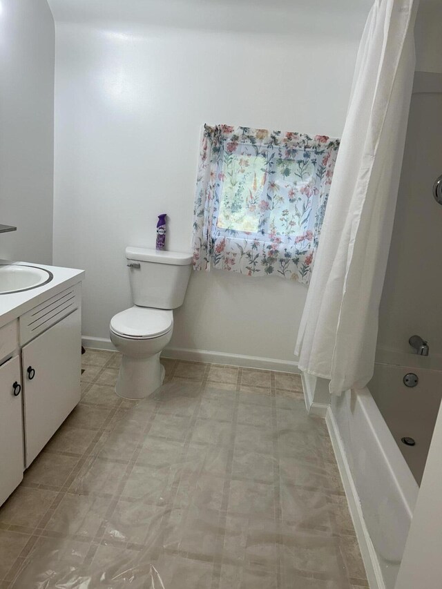 13664 Wabasis Ave NE, Cedar Springs, MI 49319 - full bath featuring toilet, vanity, shower / bath combo with shower curtain, tile patterned floors, and baseboards