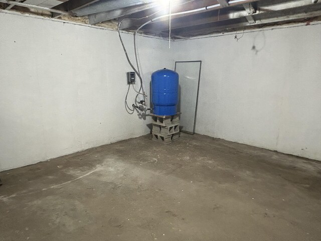 13664 Wabasis Ave NE, Cedar Springs, MI 49319 - unfinished basement with a water pressure tank