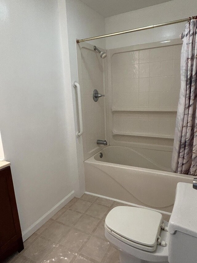 13664 Wabasis Ave NE, Cedar Springs, MI 49319 - bathroom featuring toilet, shower / bath combo with shower curtain, baseboards, and vanity