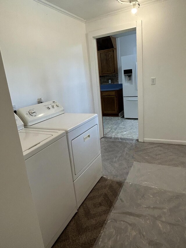 13664 Wabasis Ave NE, Cedar Springs, MI 49319 - laundry room featuring washing machine and dryer, ornamental molding, and baseboards