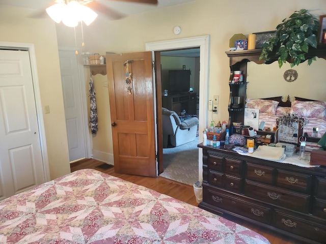 bedroom with ceiling fan and light wood-type flooring