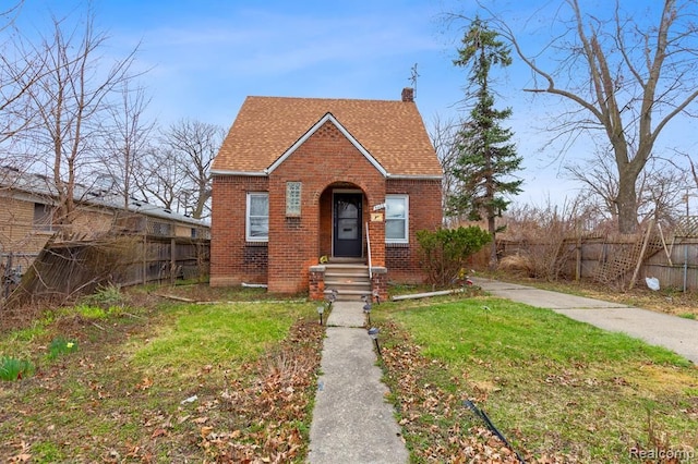 view of front of home with a front lawn