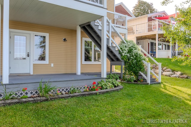 doorway to property featuring a yard