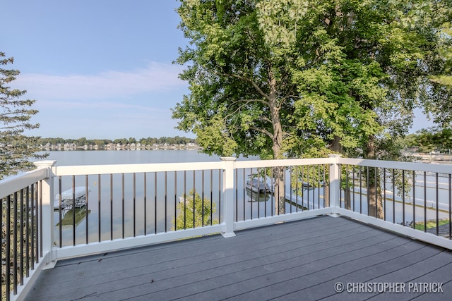 wooden terrace with a water view