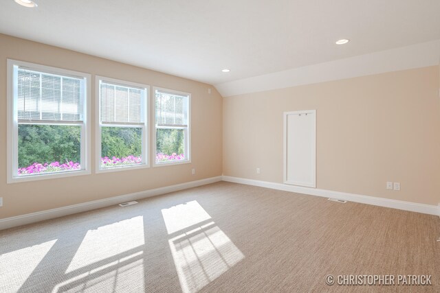 unfurnished room with light carpet, baseboards, vaulted ceiling, and recessed lighting