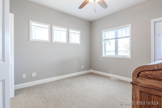 bedroom featuring ceiling fan, carpet, visible vents, and baseboards