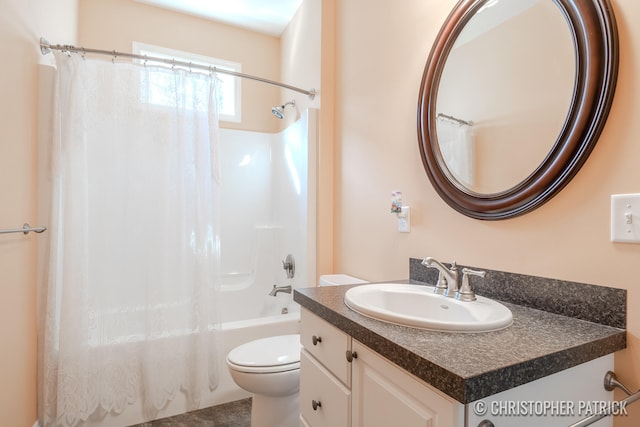 bathroom featuring shower / tub combo, vanity, and toilet