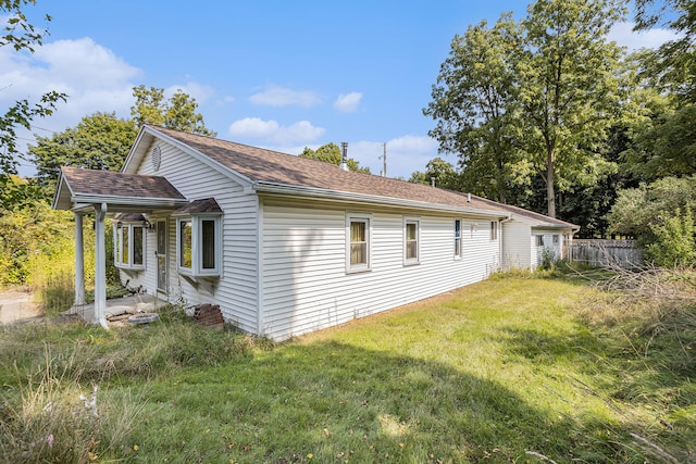 view of property exterior featuring a yard