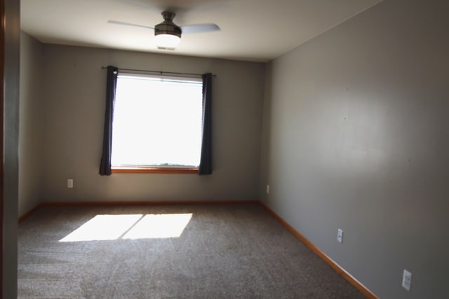 carpeted empty room with ceiling fan