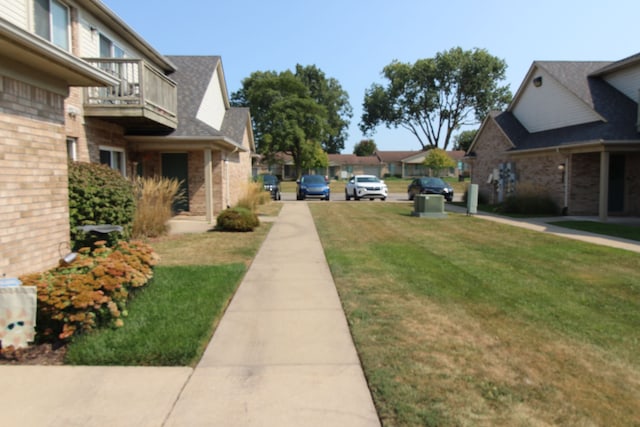 surrounding community featuring a lawn