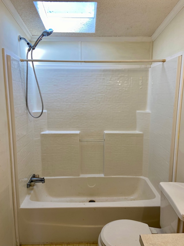 bathroom with a skylight, toilet, shower / bath combination, and ornamental molding