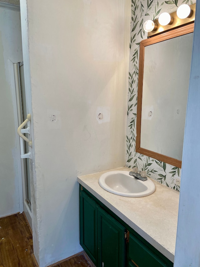 bathroom with vanity and wood-type flooring