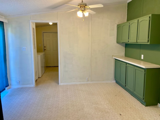 unfurnished room with ornamental molding, a textured ceiling, vaulted ceiling, ceiling fan, and washer / dryer