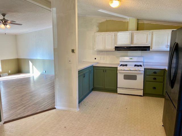 kitchen featuring white cabinets, light hardwood / wood-style floors, white range with gas stovetop, and a textured ceiling