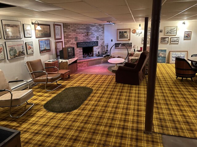 2768 S M-88, Bellaire, MI 49615 - living room featuring a paneled ceiling and a fireplace