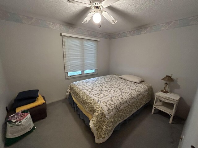 2768 S M-88, Bellaire, MI 49615 - carpeted bedroom featuring ceiling fan and a textured ceiling