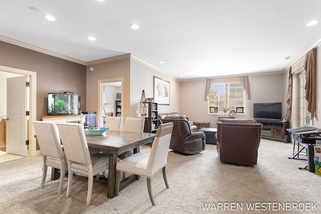 carpeted dining area featuring crown molding