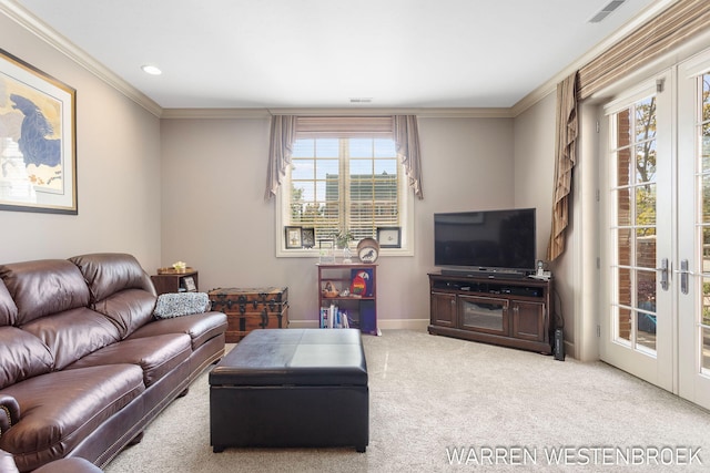 carpeted living room with french doors and crown molding