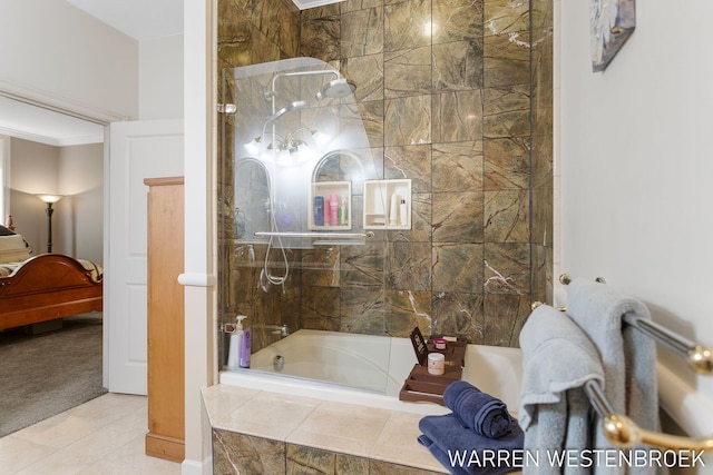 bathroom featuring tile patterned floors, crown molding, tile walls, and tiled shower / bath