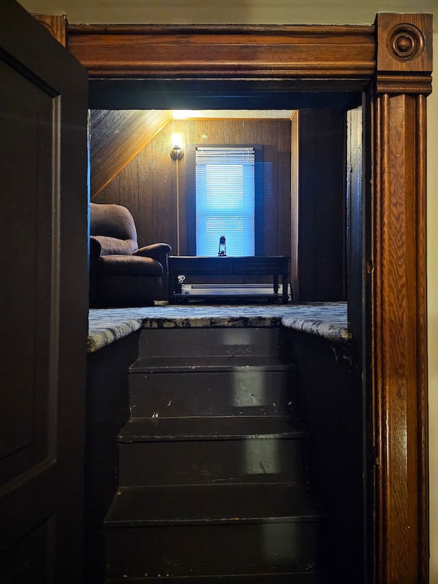 interior space featuring wood walls