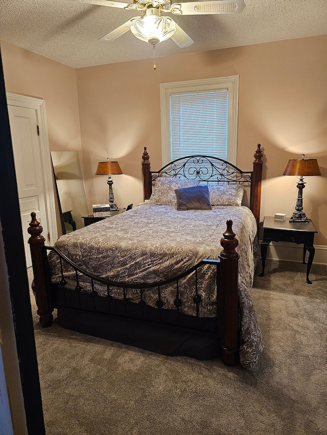 bedroom with carpet, ceiling fan, and a textured ceiling