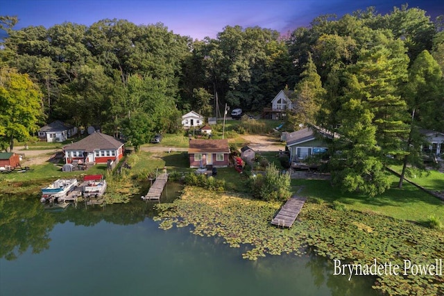 748 Kimberly Dr NE, Sparta, MI 49345 - aerial view of property's location featuring a nearby body of water and a forest