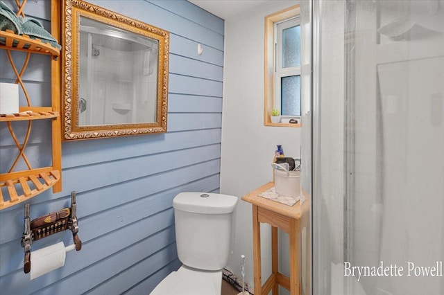 748 Kimberly Dr NE, Sparta, MI 49345 - full bath featuring toilet, wooden walls, and a shower