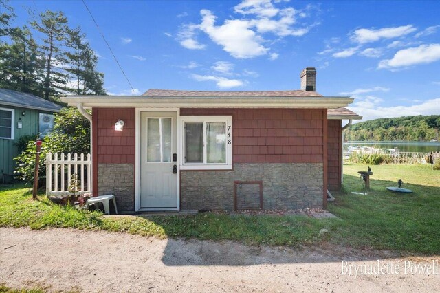 748 Kimberly Dr NE, Sparta, MI 49345 - view of outbuilding featuring a water view