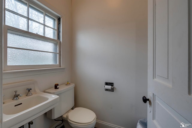 bathroom with toilet and sink