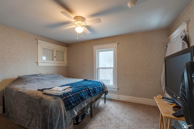 bedroom with ceiling fan and carpet