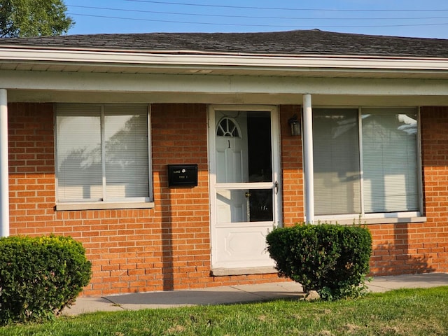 22444 S Kelly Rd, Eastpointe, MI 48021 - doorway to property with brick siding and a shingled roof