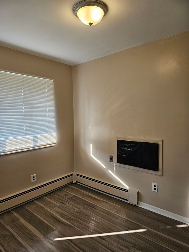 22444 S Kelly Rd, Eastpointe, MI 48021 - spare room with wood finished floors, baseboards, and a baseboard radiator