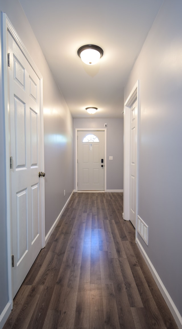 doorway featuring dark wood-type flooring