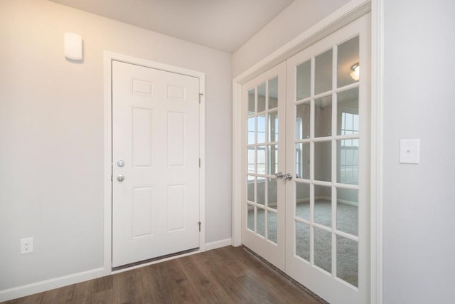 entryway with dark hardwood / wood-style flooring and french doors