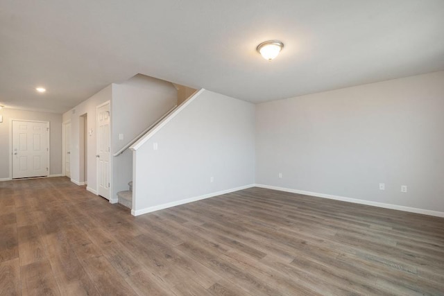 empty room featuring dark wood-type flooring