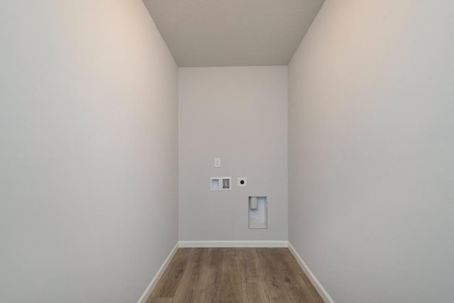 washroom featuring hardwood / wood-style floors, hookup for a washing machine, and hookup for an electric dryer