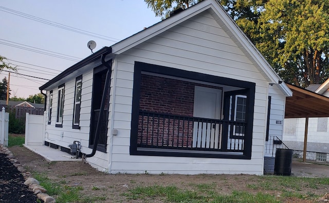 view of home's exterior featuring a carport