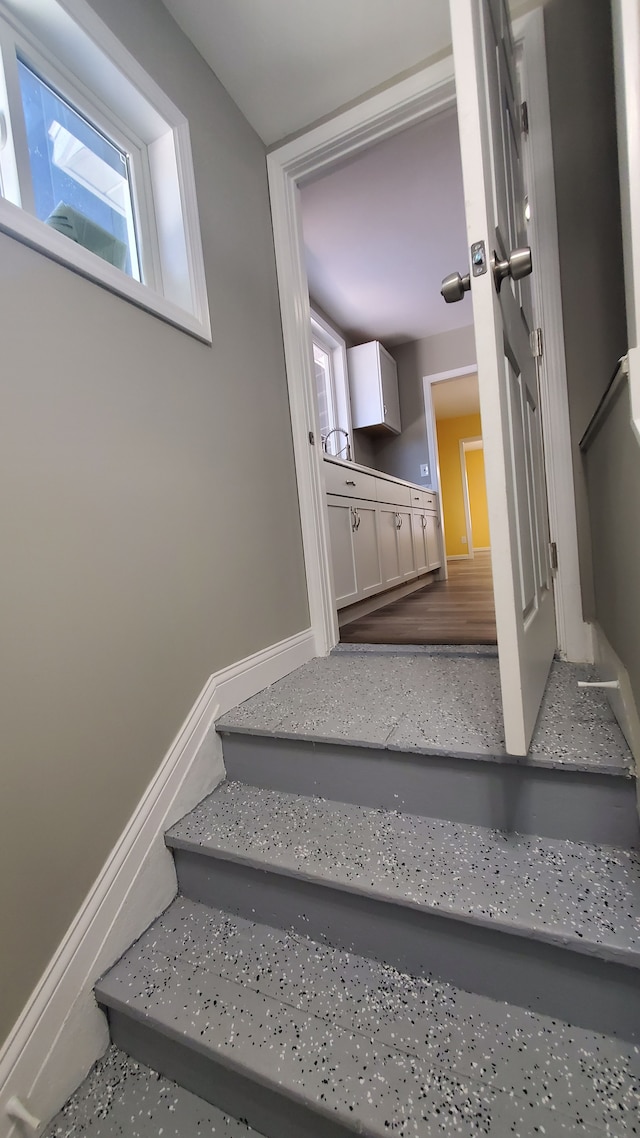 stairway featuring hardwood / wood-style floors